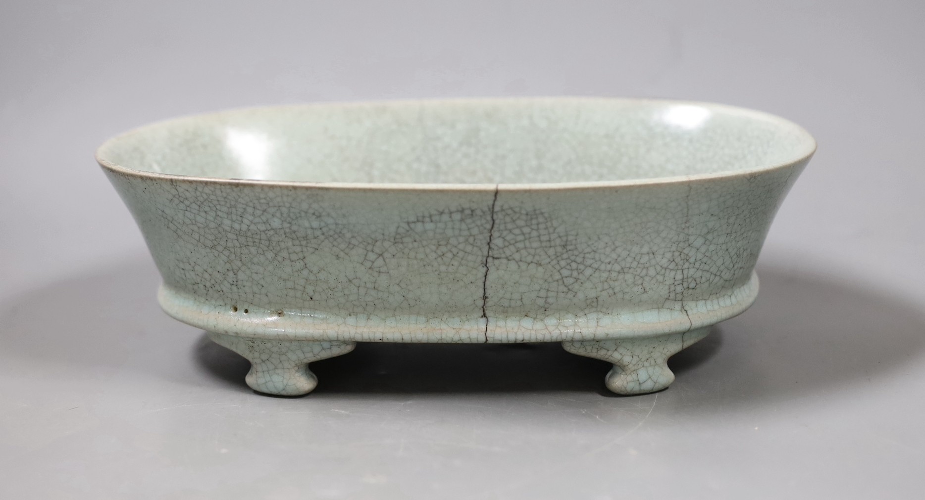 A Chinese Guan type ceramic crackle glaze narcissus bowl. 24cm wide, cracked